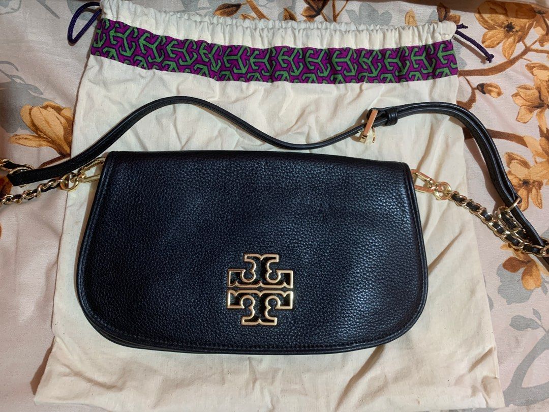 Authentic Tory Burch Britten Black Leather Crossbody Bag (Category: Luxury Bags & Wallets) located in Aritao. Submitted by rosiee16 (Listing ID 1405449456, Image 1). Description: - Tory Burch crossbody bag - Black leather - Gold-tone logo - Chain strap - Includes dust bag - Zipper closure - Interior gold-tone logo - Made in China.
