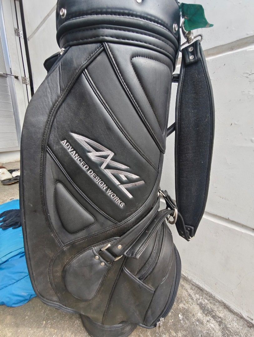Axel Advanced Design Works Golf Bag (Category: Golf) located in Manila. Submitted by babz30261 (Listing ID 1405400888, Image 1). Description: - Black Axel Advanced Design Works golf bag - Multiple compartments for storage - Comfortable shoulder strap - Includes a zippered pocket - Features a decorative tag - Made of leather.