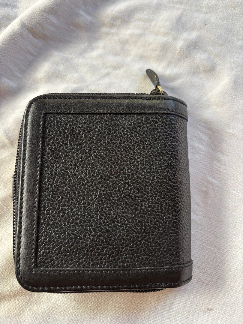 Bally Black Leather Wallet (Category: Luxury Bags & Wallets) located in Tarlac. Submitted by vectorreyes (Listing ID 1405397923, Image 2). Description: - Authentic Bally black leather wallet - Features zip-around and snap closure - Gold-tone 'B' logo detail - Interior with multiple card slots and compartments - Bally logo on lining - Made of textured leather - coin slot: need leather replacement.