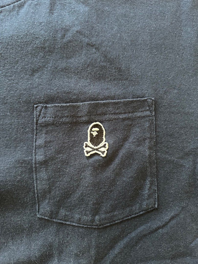 BAPE Pirate Skull Pocket Tee XL (Category: Tshirts & Polo Shirts ) located in Paranaque City. Submitted by mrbentables (Listing ID 1405527652, Image 2). Description: - Navy blue BAPE t-shirt - Size: XL - Design: Skull pocket - Features BAPE logo on neck tag and sleeve - Material: 100% cotton - Style: Crew neck, short sleeves.