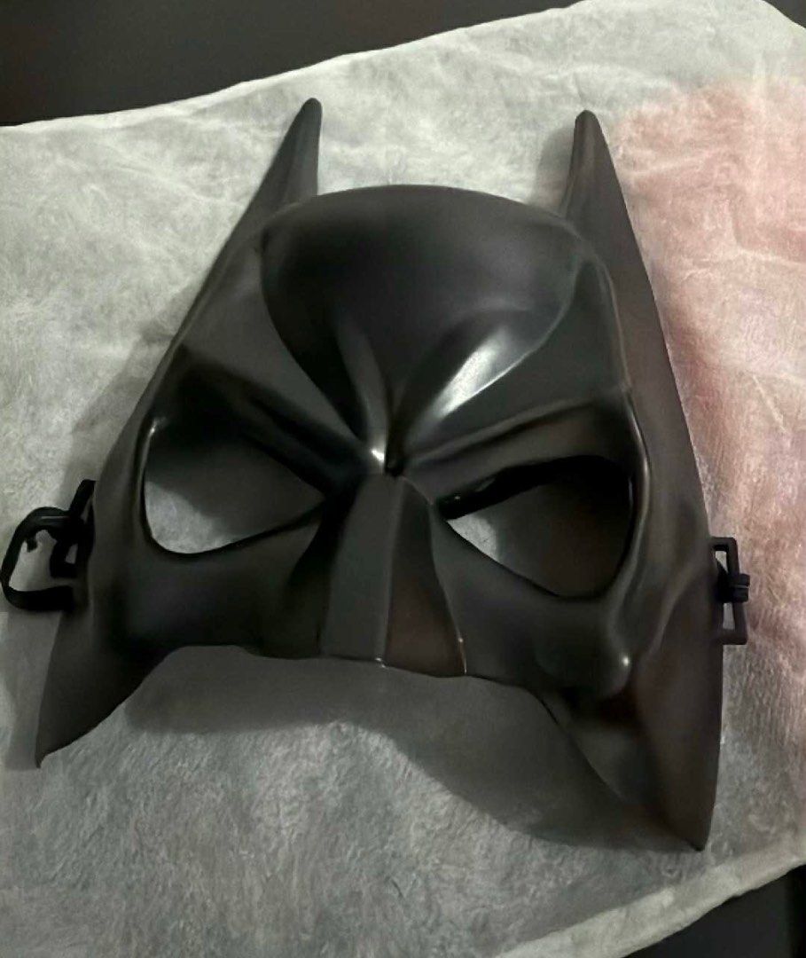 Batman Mask (Category: Western Merchandise) located in General Trias. Submitted by mirelssss (Listing ID 1405366729, Image 1). Description: - Batman mask - Black plastic - Iconic Batman cowl shape - Pointed ears - Eye openings - Includes straps - Perfect for cosplay or Halloween - used this for a last minute costume!! .