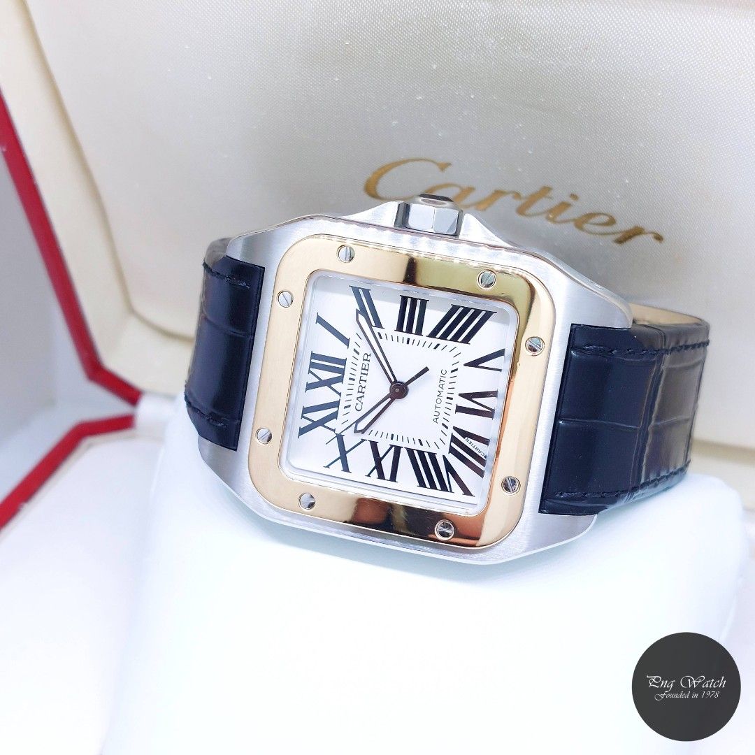 Cartier 51mm X 41mm Silver Opaline Roman Dial 18K Half Yellow Gold Santos 100 Large REF: W20072X7 (Full Set) (Category: Watches) located in Singapore. Submitted by pngwatchdealer (Listing ID 1405518895, Image 2). Description: [SPECIFICATIONS] **Watch comes in full set (Box & Card)** Brand: Cartier Model: Santos 100 Large (REF: W20072X7)(UD)(O) Movement: Automatic (Self-Winding) Functions and Features: Hours, Minutes and Seconds (CASE) Case Materi