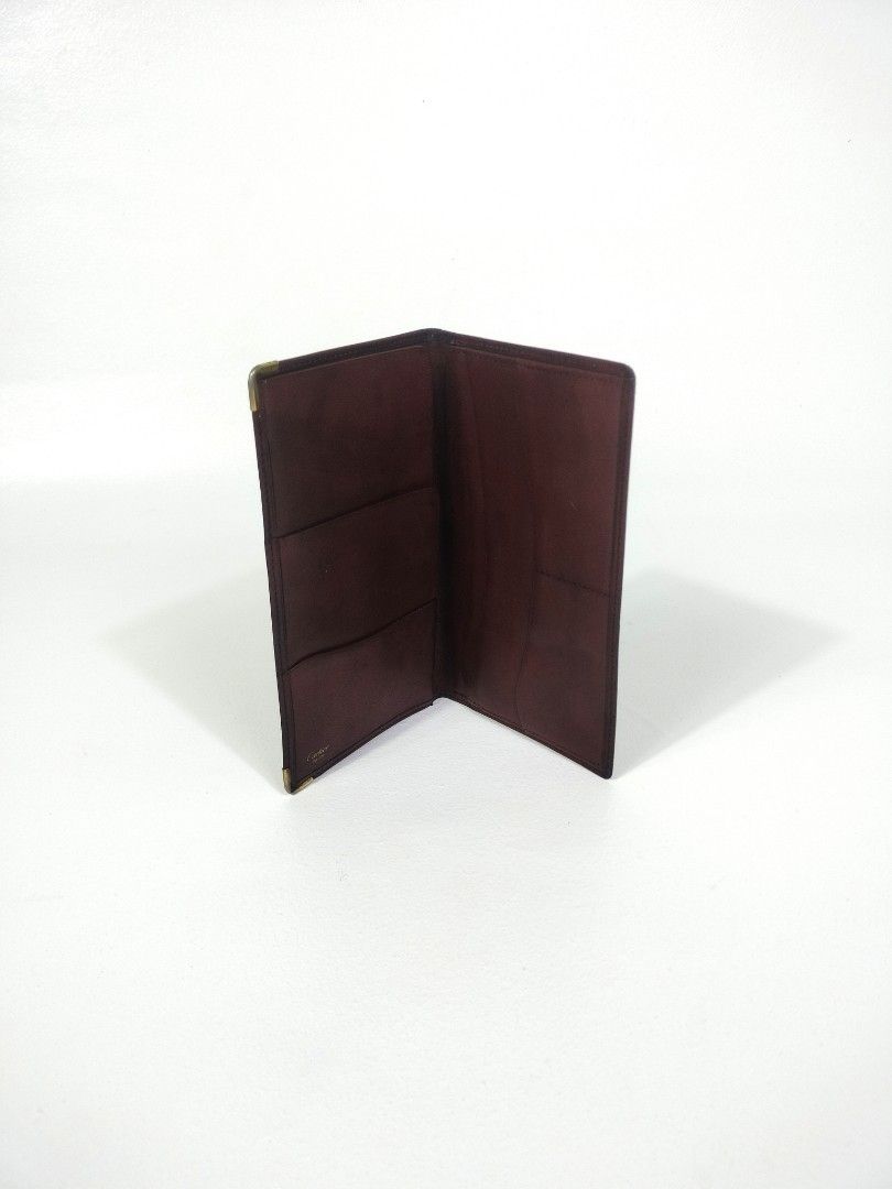 Cartier Leather Wallet (Category: Luxury Bags & Wallets) located in Manila. Submitted by callmetin (Listing ID 1405507591, Image 2). Description: - Authentic Cartier wallet - Rich burgundy leather - Multiple card slots - Bill compartment - Subtle Cartier logo embossing - Gold-toned metal corner reinforcements - Crafted from high-quality leather.