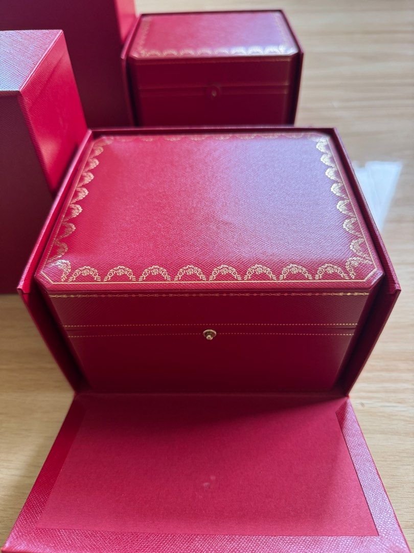 Cartier Watch Box (Category: Luxury Watches) located in Quezon City. Submitted by tag42 (Listing ID 1405353493, Image 3). Description: - Authentic Cartier watch box - Red exterior - Gold-colored clasp - Black fabric interior - Includes watch pillow - Comes with outer box - Cartier logo visible.