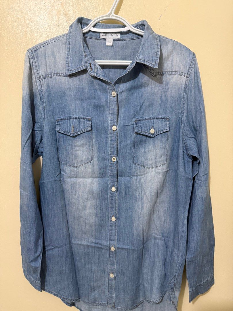 Cotton On Denim Polo - Size S (Category: Shirts) located in Manila. Submitted by iamroxv (Listing ID 1405497646, Image 1). Description: - Cotton On denim shirt - Size: S - Light blue wash - Classic button-down design - Two chest pockets - Long sleeves - Made in China - Perfect for casual outfits - Fits small to medium.