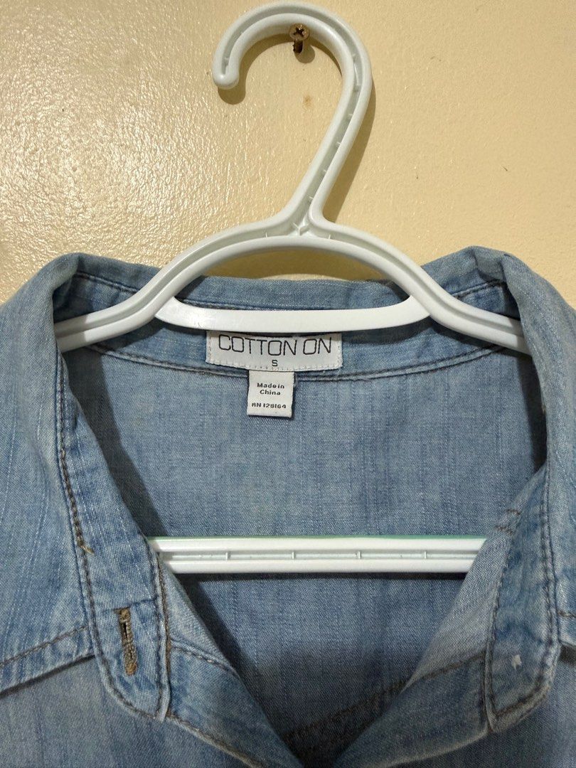 Cotton On Denim Polo - Size S (Category: Shirts) located in Manila. Submitted by iamroxv (Listing ID 1405497646, Image 3). Description: - Cotton On denim shirt - Size: S - Light blue wash - Classic button-down design - Two chest pockets - Long sleeves - Made in China - Perfect for casual outfits - Fits small to medium.