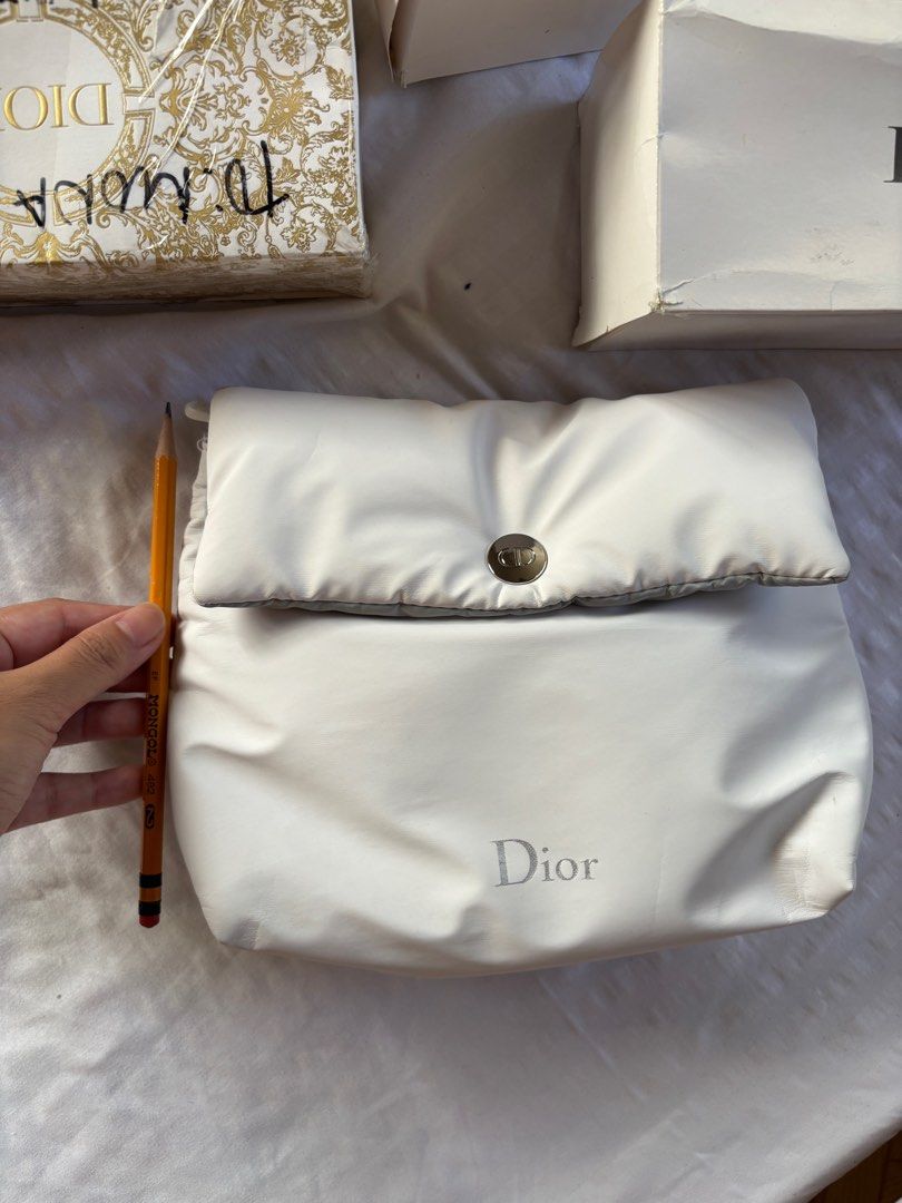 Dior Cosmetic Pouch (Category: Luxury Bags & Wallets) located in Tarlac. Submitted by vectorreyes (Listing ID 1405404484, Image 3). Description: - Authentic Dior cosmetic pouch - White exterior with Dior logo - Light grey interior with Dior logo pattern - Zipper closure - Snap closure - Material: Polyurethane - -GWP gift for VIP Client with qualifying purchases .