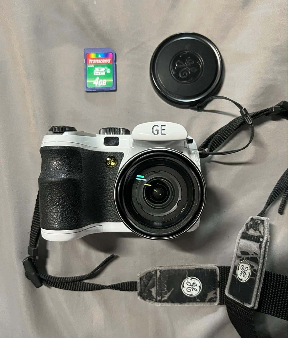 GE X500 Camera (Category: Cameras) located in Muntinlupa City. Submitted by el1b12345 (Listing ID 1405451207, Image 2). Description: GE X5 Digital Camera 📸✨ ₱7,000 💰 💥 Issue: leather strap is flaking off, and paint on thumb rest slightly faded.(See photos for reference) 📷 Specs: • 14 megapixels • 15x optical zoom + 5.7x digital zoom • 2.7” LCD screen (auto brightness) • Face detection, smile & blink detection • In-camera red-eye removal & ima