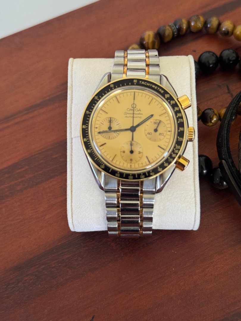 Omega Speedmaster Reduce - Gold (Category: Luxury Watches) located in Quezon City. Submitted by tag42 (Listing ID 1405359409, Image 3). Description: - Omega Speedmaster Automatic - Chronograph - Reduce - Gold-tone dial - Stainless steel bracelet - Black bezel with tachymeter - Includes original box, operating instructions, - Two-tone bracelet - Gold accents on the case.