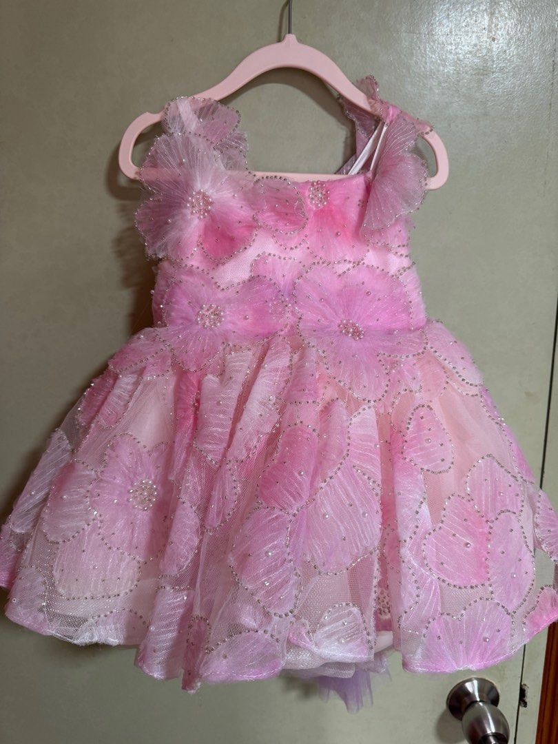 Pink Flower Dress from mamanbebeph (Category: Babies & Kids Fashion) located in Mandaluyong City. Submitted by iamjenfr (Listing ID 1405362629, Image 3). Description: Pink floral gown from mamanbebeph. Used this for my baby’s photoshoot & 1st bday celeb. Used this for a few hours lang so like new! So pretty and unique!! Original size is a bit bigger than my baby so pina adjust namin yung zipper, pero if ever pwede sya ibalik para pag lumaki si ba