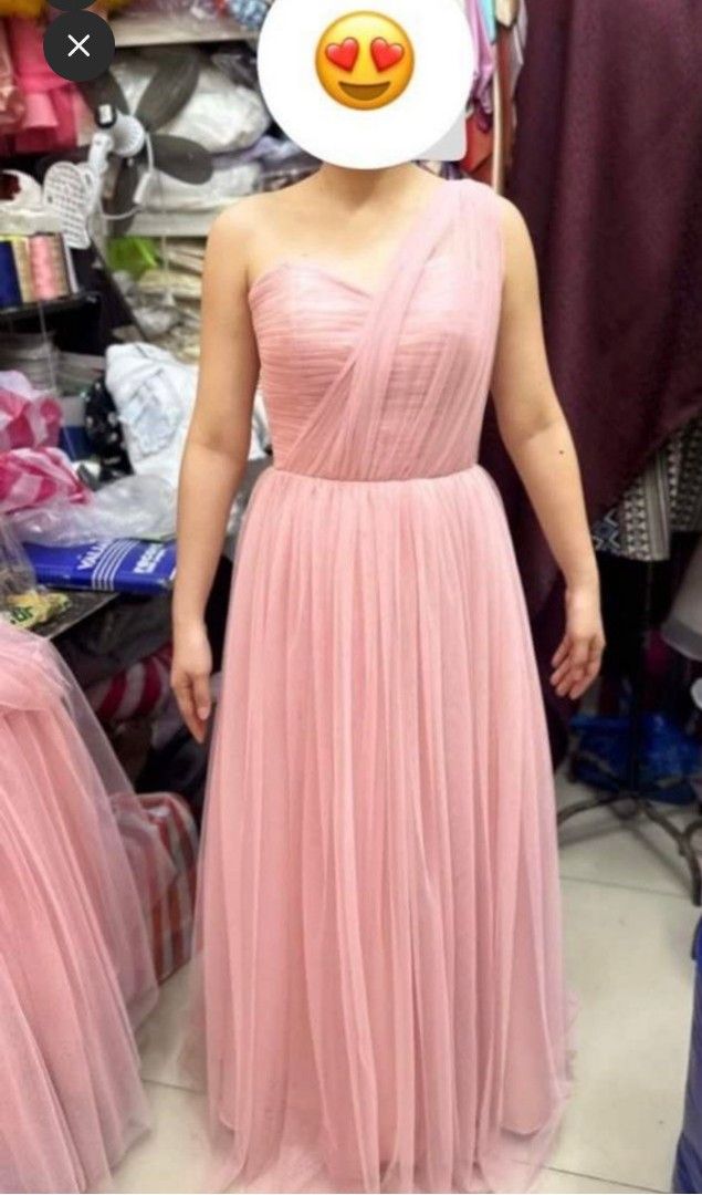 Pink Tulle Bridesmaid Gown (Category: Evening dresses & gowns) located in Iloilo. Submitted by lissuin (Listing ID 1405460669, Image 3). Description: Pink tulle bridesmaid gown/dress Can be worn in 4 ways (as shown in the pictures) With padding With slit Measurements: Bust - 31 Waist - 25 Hip length - 50 Altered to fit narrower bust but the stitching can be removed to return it to its original size. Minor flaw: Has a slight rip at the hem of dres