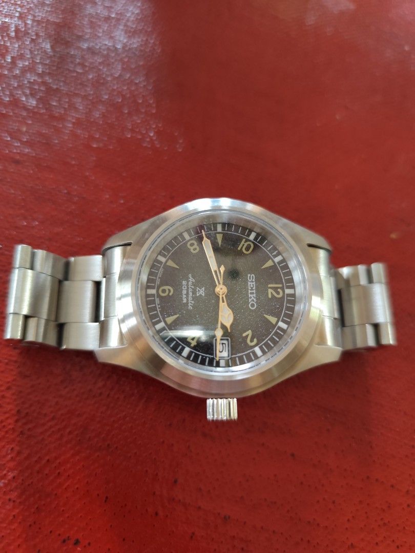 Seiko Baby Alpinist Mod (Category: Men's Watches) located in Davao. Submitted by papa1919 (Listing ID 1405349163, Image 2). Description: Brushed stainless steel case 39.7mm case diameter Seiko 7s26 automatic movement Sandy green textured dial Screwdown crown.