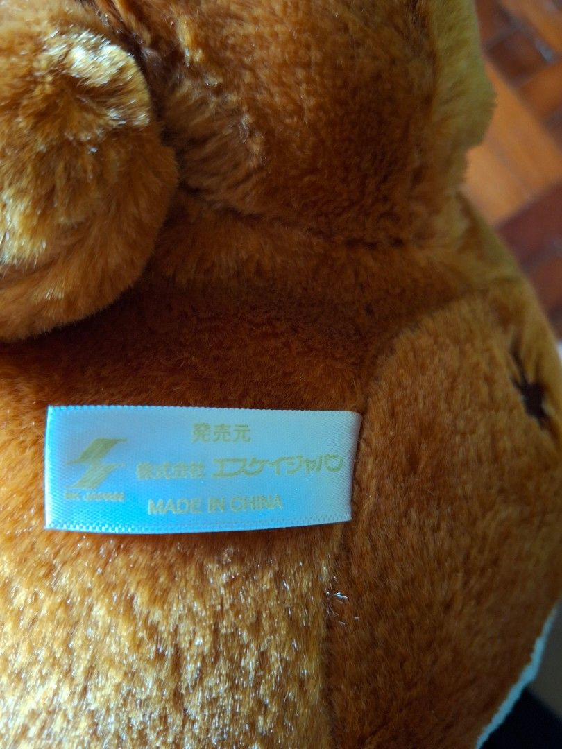 Shiba Inu Plush Toy (Category: Plushies & Soft Toys) located in Quezon City. Submitted by pure_trinsky (Listing ID 1405349995, Image 3). Description: Adorable Shiba Inu plush toys. One is wearing a blue outfit and hat, the other has a "Meet Friends" bandana. Both have cute expressions. Made in China. The tag says "SK-Japan". Price: 380 each.