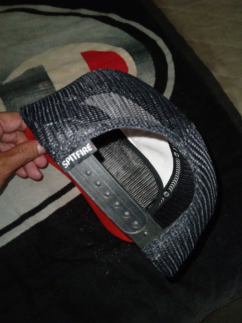 Spitfire Wheels Cap (Category: Caps & Hats) located in Manila. Submitted by bethlehema07352 (Listing ID 1405449061, Image 3). Description: - Spitfire Wheels cap - Color scheme: Red, white, and black - Spitfire Wheels logo on front - Mesh back - Adjustable strap - Material: Nylon and cotton.