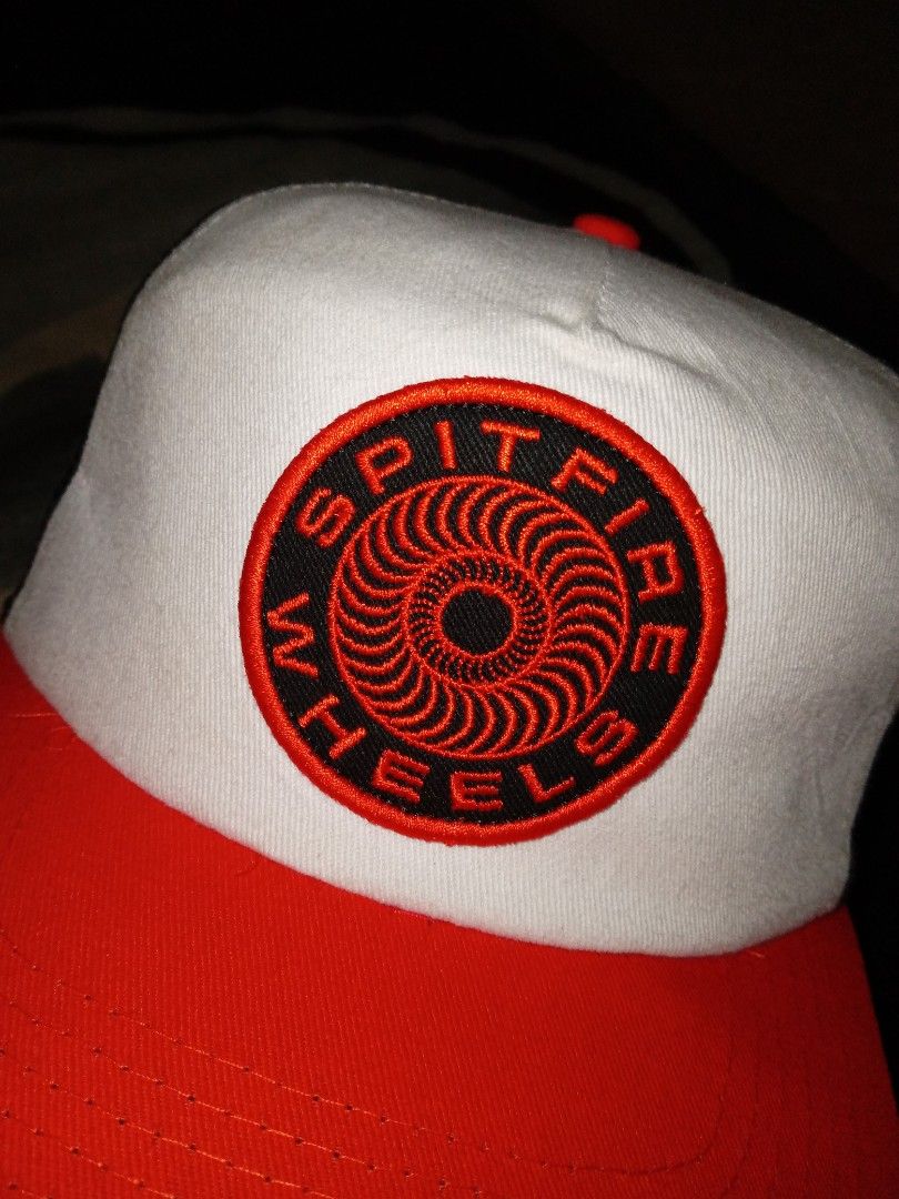 Spitfire Wheels Cap (Category: Caps & Hats) located in Manila. Submitted by bethlehema07352 (Listing ID 1405449061, Image 2). Description: - Spitfire Wheels cap - Color scheme: Red, white, and black - Spitfire Wheels logo on front - Mesh back - Adjustable strap - Material: Nylon and cotton.
