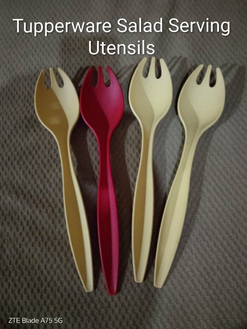 Tupperware Salad Serving Utensils (Category: Dinnerware & Cutlery) located in Lucena. Submitted by miles.miles1 (Listing ID 1405431257, Image 1). Description: - Tupperware salad serving utensils set. - Includes 3 off-white and 1 red utensil. - Features a fork-like design. - Ideal for serving salads and various dishes. - Stylish and practical kitchen addition..