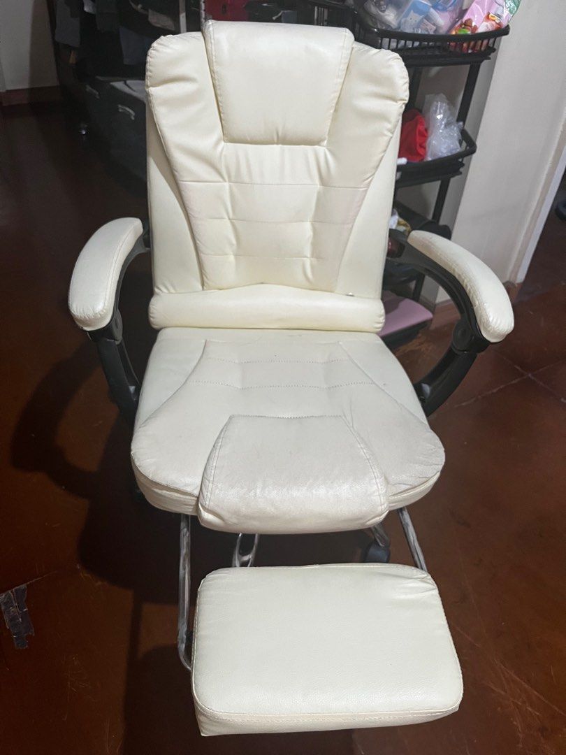 White Office Chair with Footrest (Category: Office Furniture & Fixtures) located in Quezon City. Submitted by kjp78 (Listing ID 1405373014, Image 1). Description: - White office chair - Built-in footrest - Armrests has slight defect - high back for support - Chrome base with wheels - Padded seat and backrest - wear and tear on the back by our cat - For pick-up only.