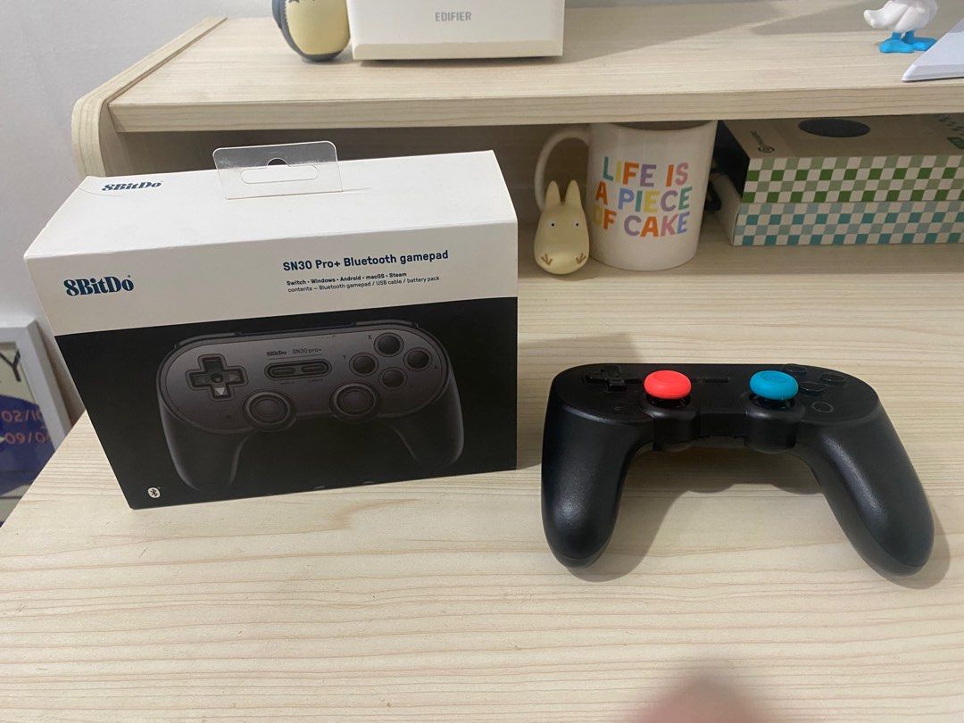 8BitDo SN30 Pro+ Bluetooth Gamepad (Category: Controllers) located in Iloilo. Submitted by TheKinfolkGarage (Listing ID 1405172694, Image 1). Description: - 8BitDo SN30 Pro+ Bluetooth gamepad - Features a classic design with red and blue buttons - Comes with the original box - Compatible with multiple gaming platforms.