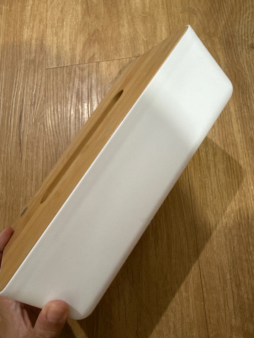 Wooden Bamboo Tissue Box (Category: Storage Boxes & Baskets) located in Mandaluyong City. Submitted by merisellsyouwhat (Listing ID 1405640775, Image 2). Description: - Natural bamboo tissue box - Features a white sides plastic material - Rectangular shape - Long, oval opening for easy tissue access - Simple, minimalist design - Suitable for various home decor styles - Standard size, fits standard tissue boxes.