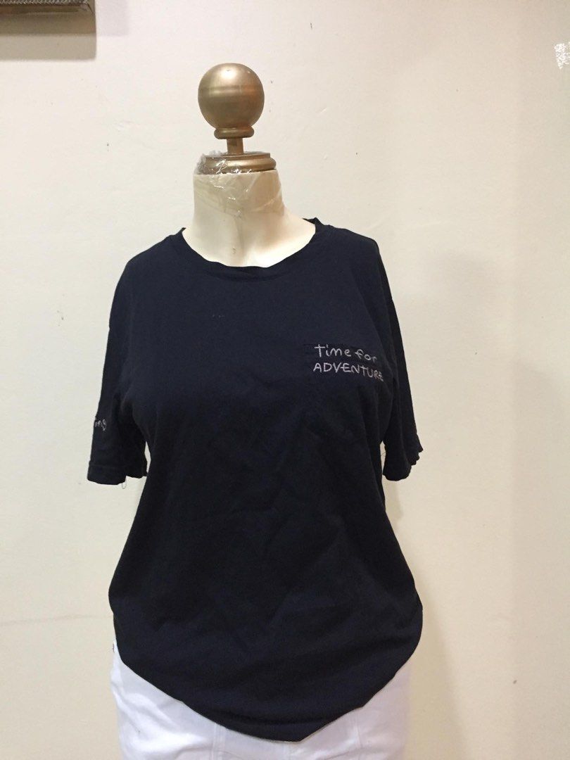 Black Time for Adventure T-shirt (Category: Tshirts & Polo Shirts ) located in Quezon City. Submitted by mdmshops (Listing ID 1405653492, Image 1). Description: - Black t-shirt - "Time for adventure" print on front - Short sleeves - Round neckline - Made of soft fabric.