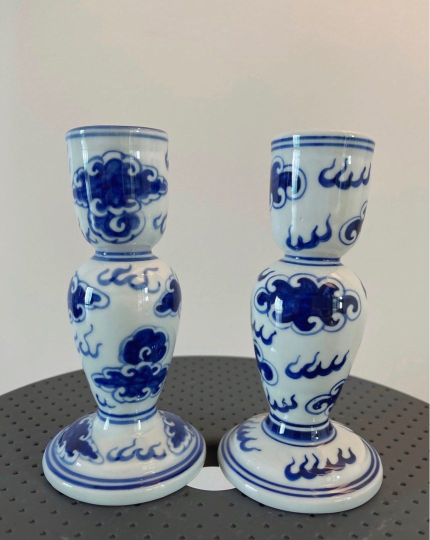 Blue and White Porcelain Candle Holders (Category: Other Home Decor) located in San Juan City. Submitted by objectofmyaffection (Listing ID 1405699989, Image 3). Description: - Blue and white porcelain candle holders - Features a classic cloud and wave design - Adds a touch of sophistication - Suitable for standard-sized candles - Perfect for home decor.