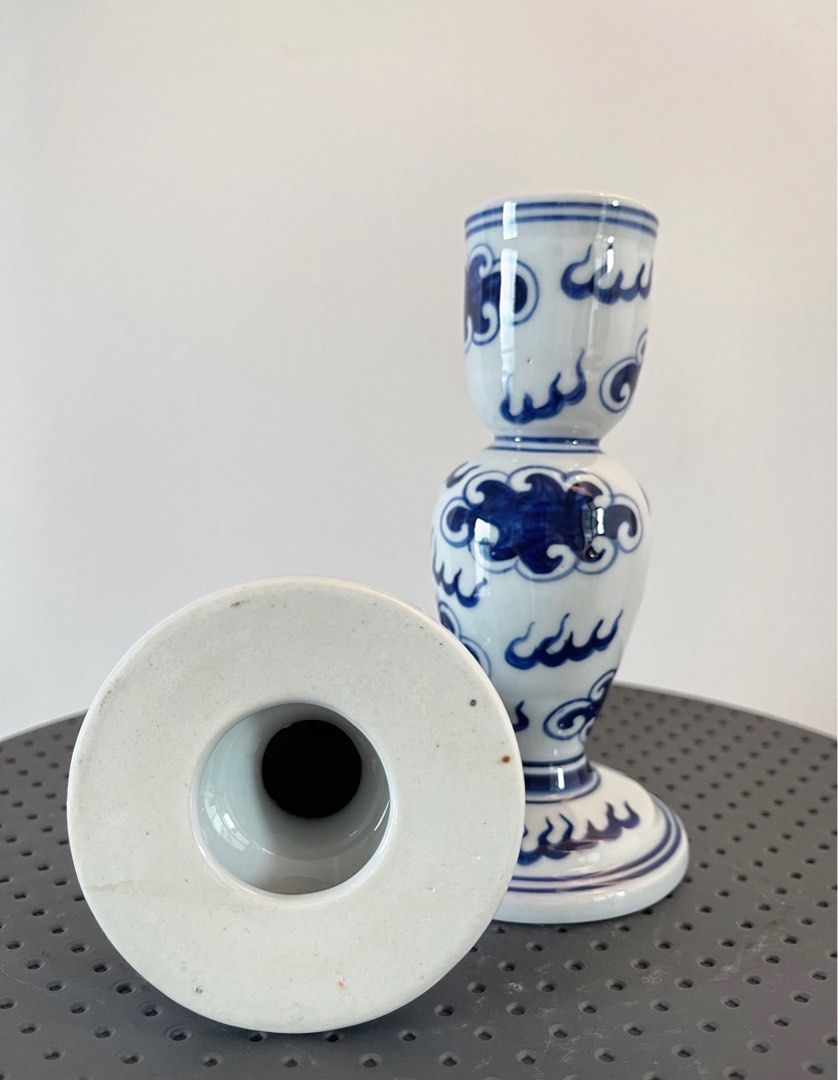 Blue and White Porcelain Candle Holders (Category: Other Home Decor) located in San Juan City. Submitted by objectofmyaffection (Listing ID 1405699989, Image 2). Description: - Blue and white porcelain candle holders - Features a classic cloud and wave design - Adds a touch of sophistication - Suitable for standard-sized candles - Perfect for home decor.