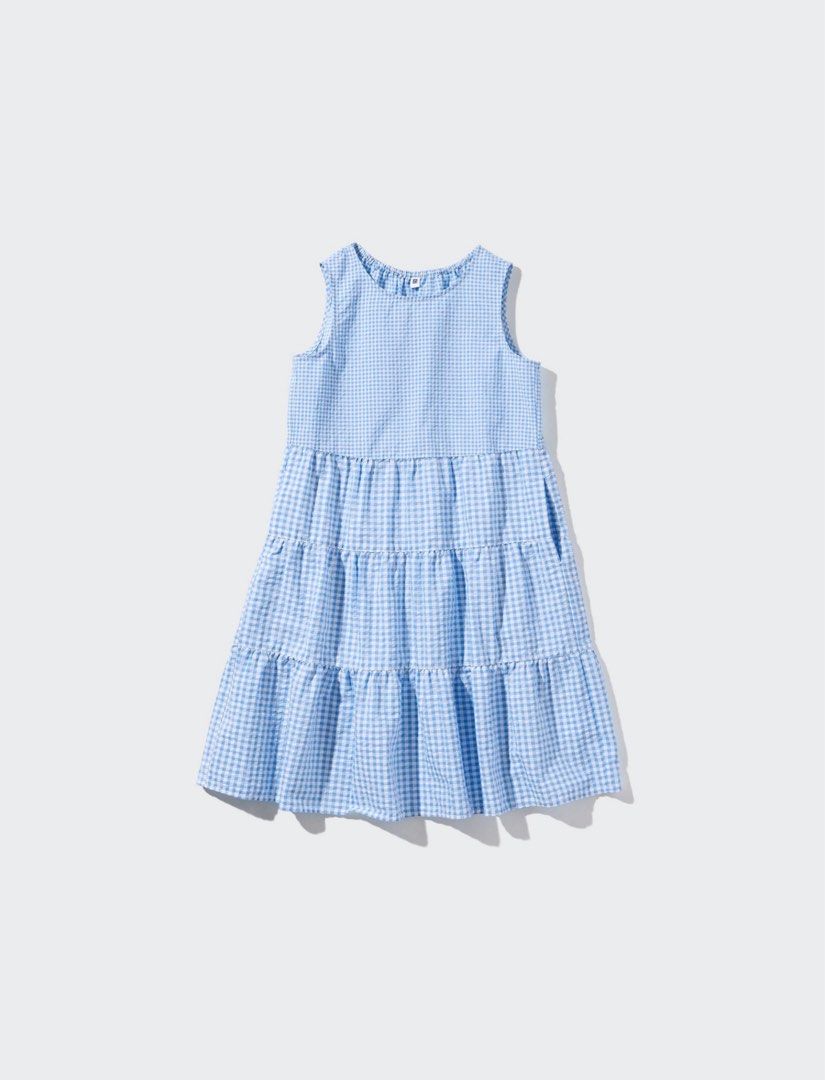 Uniqlo Blue Gingham Tiered Dress (Category: Dresses) located in Camalig. Submitted by patdeclutters (Listing ID 1405536345, Image 1). Description: Uniqlo Gingham Dress Kids size: 150 Barely worn, good as new Last photo is the actual photo (worn by me) RFS: Decluttering - Sleeveless dress - Blue and white gingham pattern - Tiered design for a flowy silhouette - Knee-length - Casual and comfortable - Perfect for warm weather.