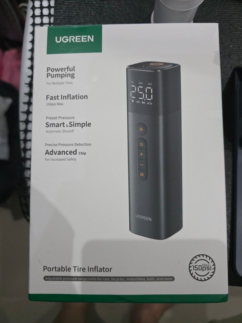 Bnew UGREEN Portable Tire Inflator ET501 (Category: Mags and Tires) located in Makati City. Submitted by harrys08 (Listing ID 1405669659, Image 1). Description: UGREEN Portable Tire Inflator ET501. Features fast inflation, precise pressure detection, and advanced safety. Includes a car charger, a storage bag, and multiple nozzle attachments. The device has an LCD screen and multiple buttons for easy operation. It is designed for multiple tire typ