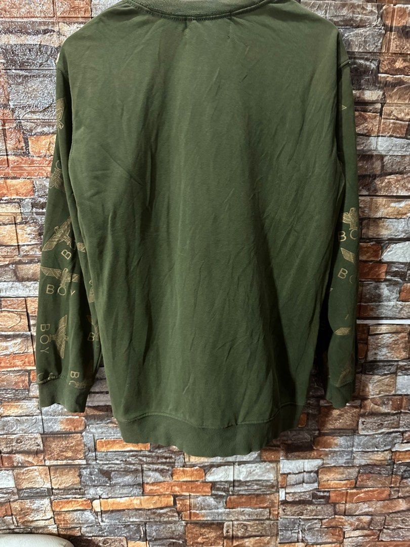 Boy London Eagle Graphic Sweatshirt (Category: Coats, Jackets and Outerwear) located in Paranaque City. Submitted by jer27.jpn (Listing ID 1405585876, Image 3). Description: - Olive green Boy London sweatshirt - Eagle graphic on front - Brand name on sleeves - Small logo patch - Crew neck - Long sleeves - Size tag visible - Made in the United Kingdom Size W22,L28 Sale 320.
