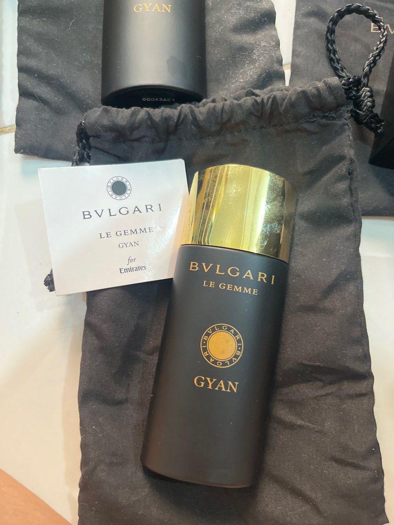 Bvlgari Le Gemme Gyan Perfume (Category: Fragrance & Deodorants) located in Muntinlupa City. Submitted by sgvcreates (Listing ID 1405562668, Image 1). Description: - Authentic Bvlgari Le Gemme Gyan perfume - Elegant black bottle with gold cap - Features the name "Gyan" - Comes with a protective pouch - Includes an accompanying card - A luxurious fragrance experience.