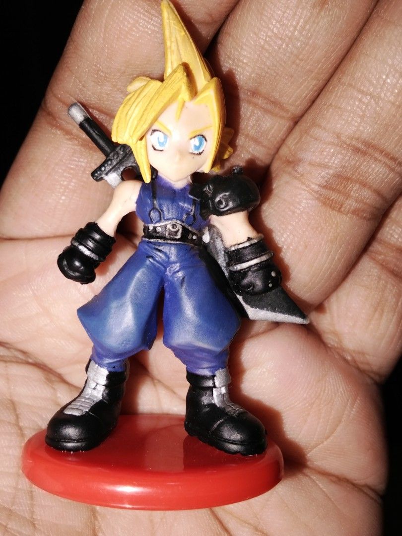 Cloud Strife Coca-Cola Figurine (Category: Figurines & Statues) located in Santa Rosa. Submitted by animemerchcollection (Listing ID 1405557098, Image 1). Description: - Cloud Strife figurine from Final Fantasy VII - Coca-Cola promotional item - Includes a red base - Features Cloud's iconic sword - Base marked with Coca-Cola logo - "Made in China" marking on the base.