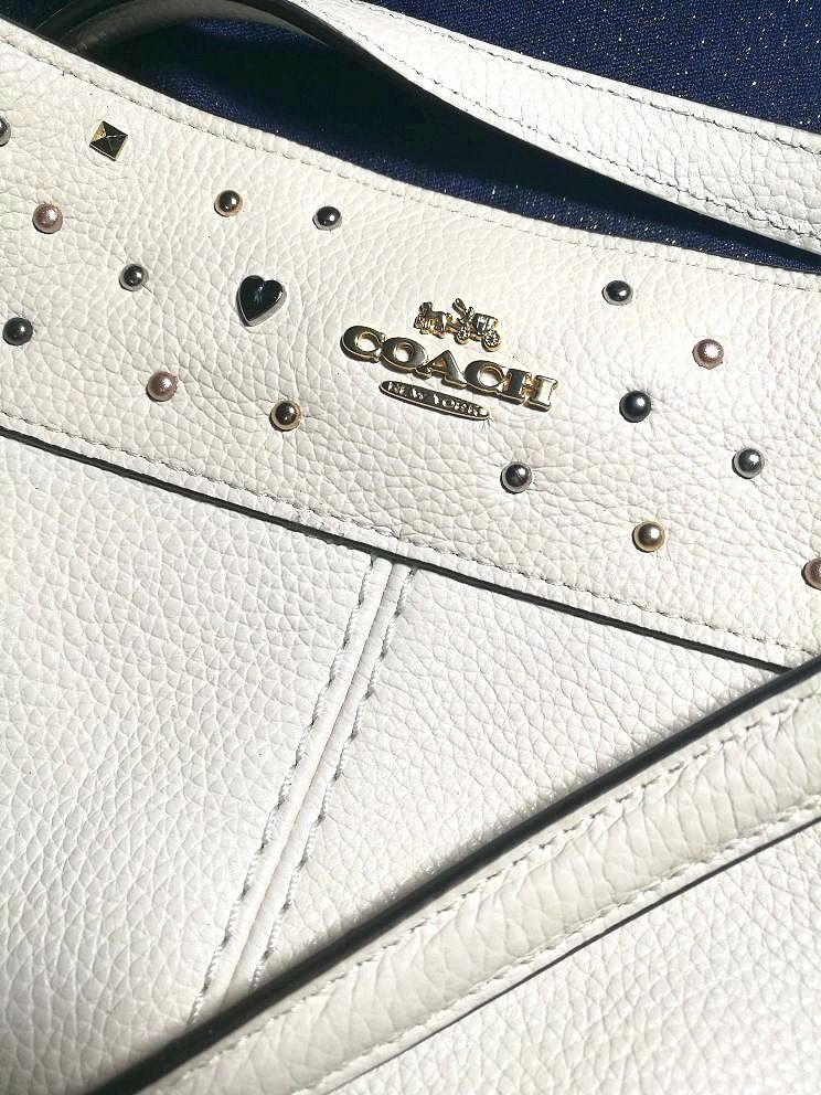 Coach Star Studded Lexy Bag (Category: Luxury Bags & Wallets) located in Quezon City. Submitted by katebutters (Listing ID 1405594248, Image 2). Description: Authentic COACH Star Studded Lexy tote. Brand new with tags in chalk off-white color. Calf leather, gold hardware, inner zipped pocket, two pockets inside, made in vietnam. Bought this in the US for $475 (Php 23,750) stored and never got to use it. Great for gifting. Original dustbag include
