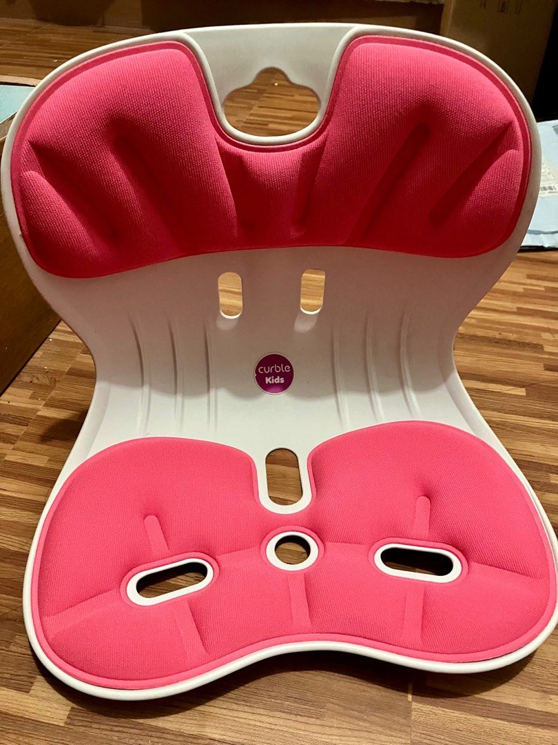 Curble Kids Posture Up Ergonomic Chair (Category: Chairs) located in Angeles City. Submitted by rsf2121 (Listing ID 1405530115, Image 3). Description: Curble Kids posture up chair. Made in Korea. Features a pink seat and white frame. Designed to promote good posture for children. The chair has a unique curved design. It is designed to support the spine and encourage proper sitting habits. The chair is lightweight and portable..