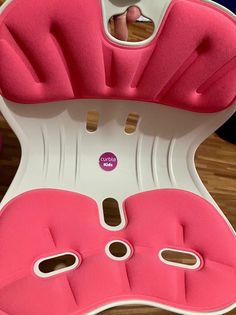 Curble Kids Posture Up Ergonomic Chair (Category: Chairs) located in Angeles City. Submitted by rsf2121 (Listing ID 1405530115, Image 1). Description: Curble Kids posture up chair. Made in Korea. Features a pink seat and white frame. Designed to promote good posture for children. The chair has a unique curved design. It is designed to support the spine and encourage proper sitting habits. The chair is lightweight and portable..
