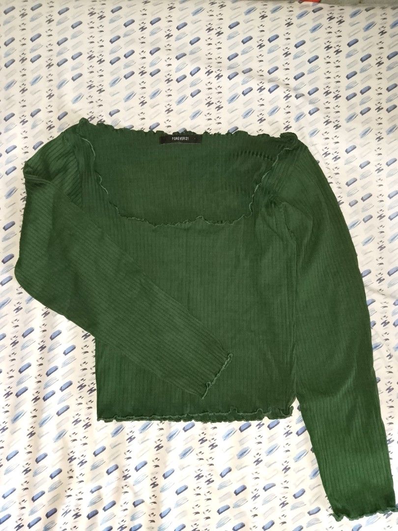 FOREVER21 Dark Green Long Sleeve Top (Category: Longsleeves) located in Pasay City. Submitted by ItsmeJayne (Listing ID 1405563822, Image 2). Description: Green long sleeve top from Forever 21. Features a square neckline with a ruffled trim. The top has a ribbed texture. The sleeves are long and fitted. The top is a solid green color..