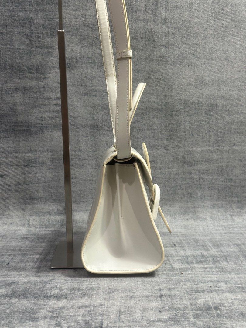 Delvaux - Brillant Mini Ivory White (Category: Luxury Bags & Wallets) located in Manila. Submitted by members-only (Listing ID 1405633062, Image 3). Description: Delvaux Brillant Mini White Box Calf Leather •off-white •flap closure •contrasting buckle detail •double top handles •internal compartment •logo charm In good and presentable condition Normal sign of usage -Can send more details thru message since photo is limit for 10pics .