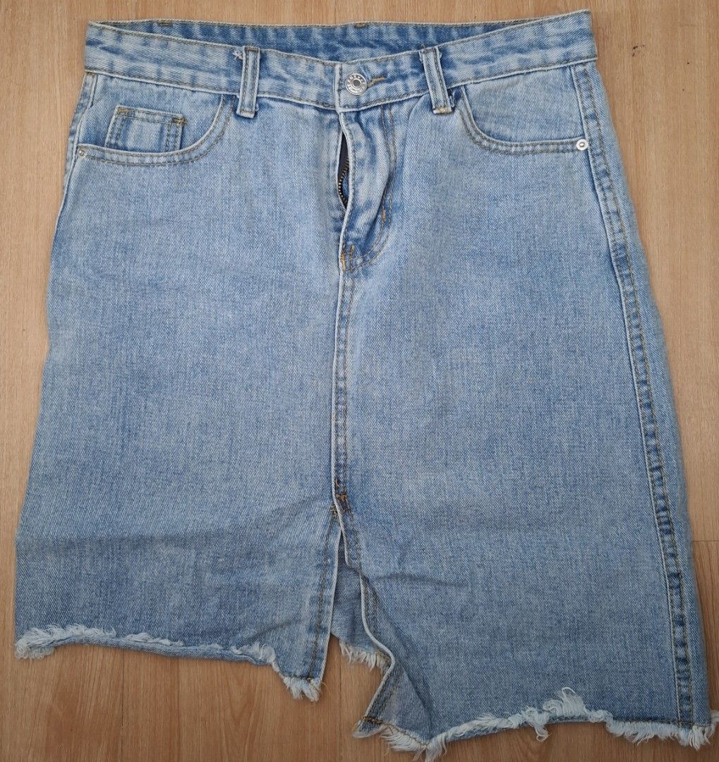Denim Skirt with Slit (Category: Skirts) located in Marilao. Submitted by yelllllll1897 (Listing ID 1405570234, Image 1). Description: - Light blue denim skirt - Front slit detail - Classic five-pocket design - Button and zipper closure - Raw, frayed hem - Dress up or down.