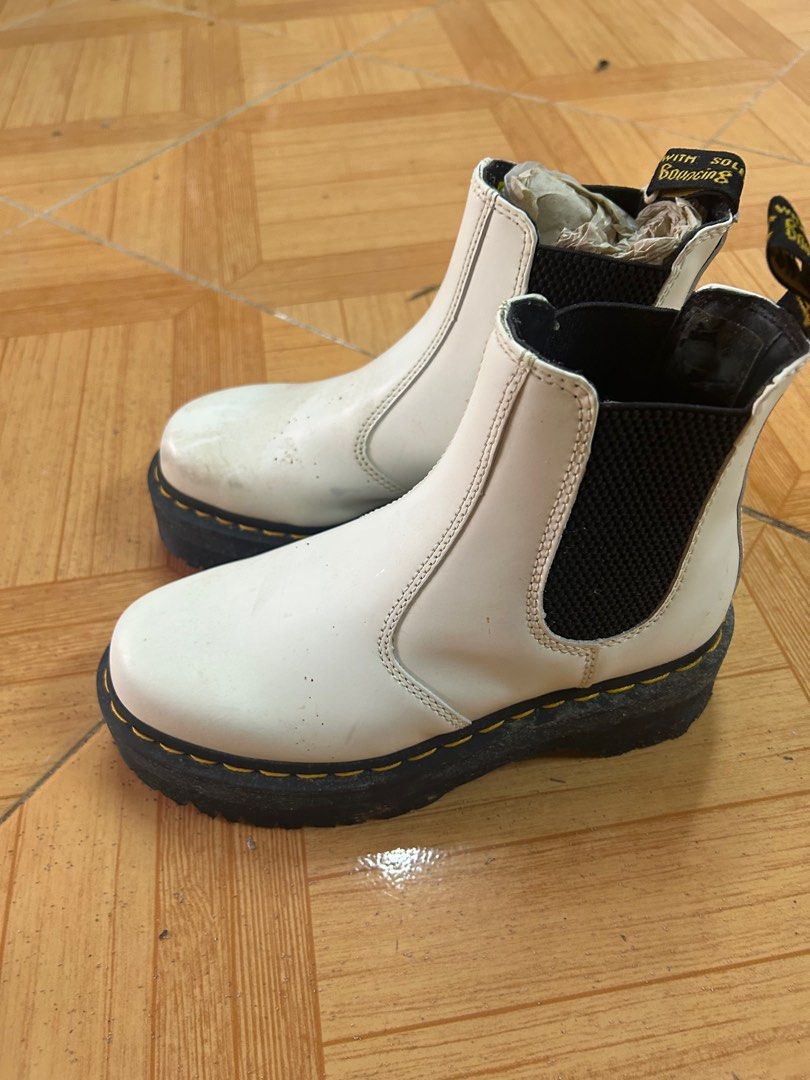 Dr. Martens White Chelsea Platform Boots (Category: Boots) located in Mandaluyong City. Submitted by paige76 (Listing ID 1405610225, Image 3). Description: - Dr. Martens Chelsea boots - Color: White - Features black elastic side panels - Thick black sole with yellow stitching - Includes original tag - Pull tab at the back Just needs cleaning.
