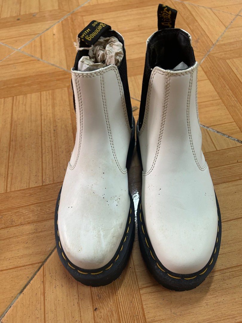 Dr. Martens White Chelsea Platform Boots (Category: Boots) located in Mandaluyong City. Submitted by paige76 (Listing ID 1405610225, Image 2). Description: - Dr. Martens Chelsea boots - Color: White - Features black elastic side panels - Thick black sole with yellow stitching - Includes original tag - Pull tab at the back Just needs cleaning.