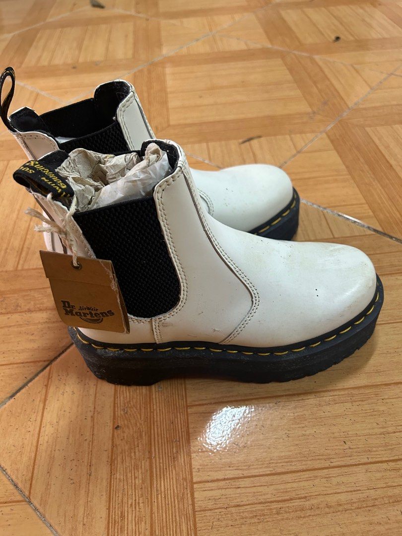 Dr. Martens White Chelsea Platform Boots (Category: Boots) located in Mandaluyong City. Submitted by paige76 (Listing ID 1405610225, Image 1). Description: - Dr. Martens Chelsea boots - Color: White - Features black elastic side panels - Thick black sole with yellow stitching - Includes original tag - Pull tab at the back Just needs cleaning.