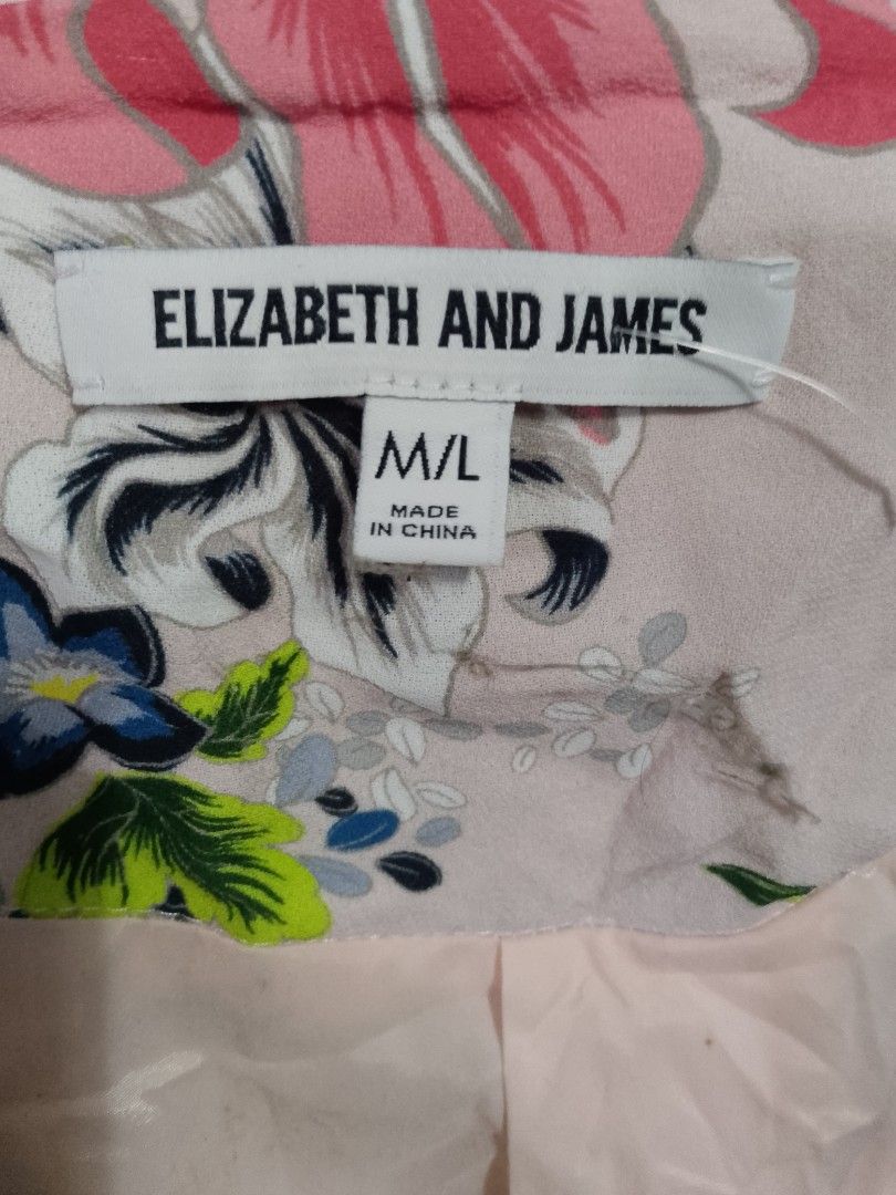 Elizabeth and James Floral Blazer (Category: Blouses) located in Paranaque City. Submitted by jaycee172623 (Listing ID 1405582759, Image 3). Description: - Elizabeth and James blouse - Floral design - V-neck - Long sleeves - Color: Light pink base with pink, blue, and green floral pattern - Size: M/L - Made in China.