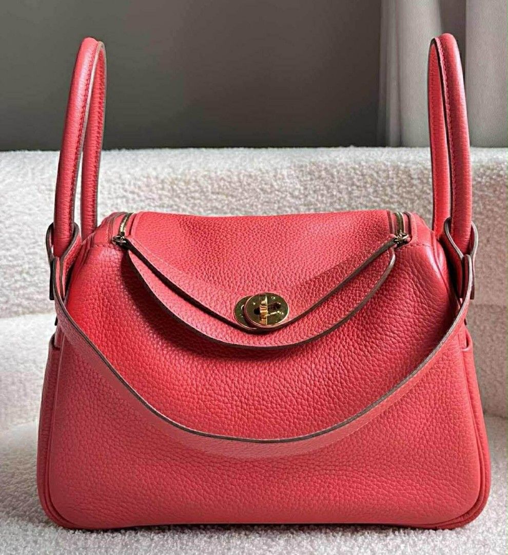 Hermes Lindy 26 (Category: Luxury Bags & Wallets) located in Cabadbaran. Submitted by luxurysourcedbyjinx (Listing ID 1405532802, Image 1). Description: - Authentic Hermes Lindy bag - Color: Red - Design: Structured with top handles and shoulder strap - Closure: Flap with gold-tone turn lock - Leather: Textured finish - Interior: Spacious, ideal for everyday essentials.