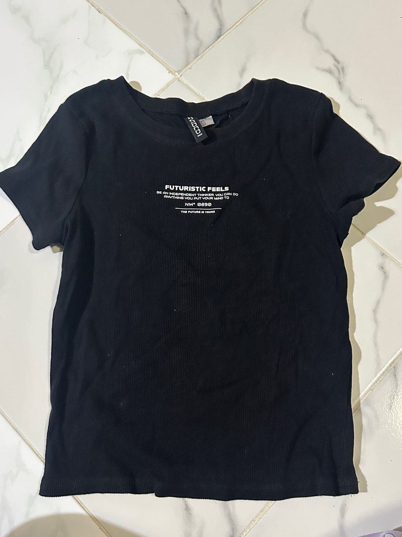 H&M Divided Black Ribbed T-shirt (Category: Shirts) located in Manila. Submitted by cchaiprincess (Listing ID 1401948464, Image 1). Description: - H&M Divided black ribbed t-shirt - Size: S - Features a graphic design - Ribbed material - In good condition.