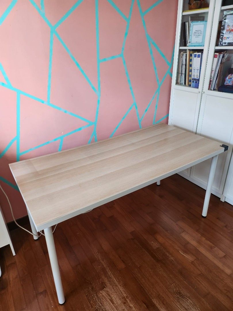 IKEA study table (Category: Tables & Sets) located in Singapore. Submitted by heyitsswathy (Listing ID 1405612333, Image 3). Description: not for a fussy buyer not sturdy but can use little bit shaky Dimensions 150cm*75cm*74cm need to make self arrangement - Stylish desk - Light wood finish - Perfect for home office or study - Simple, clean design.