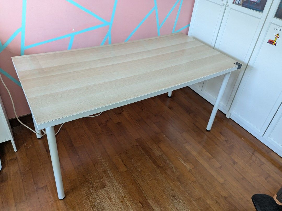 IKEA study table (Category: Tables & Sets) located in Singapore. Submitted by heyitsswathy (Listing ID 1405612333, Image 2). Description: not for a fussy buyer not sturdy but can use little bit shaky Dimensions 150cm*75cm*74cm need to make self arrangement - Stylish desk - Light wood finish - Perfect for home office or study - Simple, clean design.