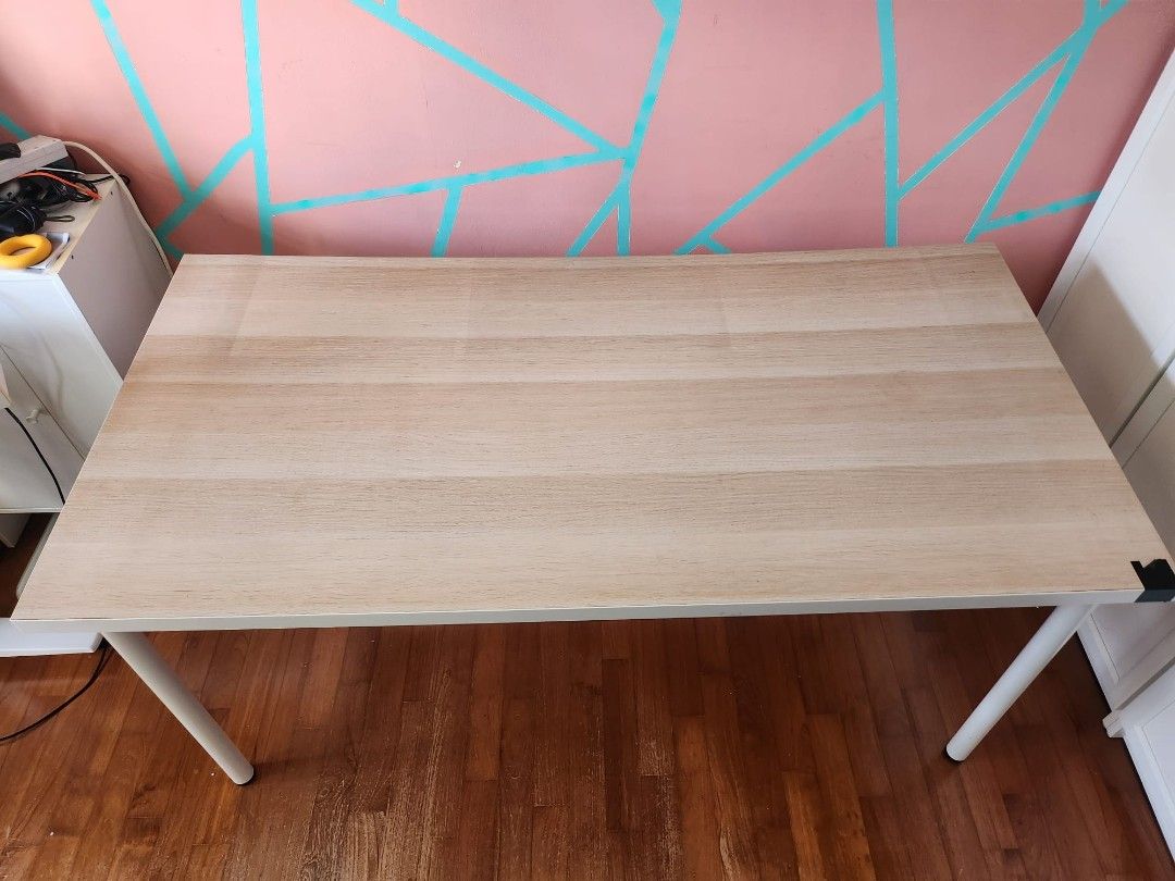 IKEA study table (Category: Tables & Sets) located in Singapore. Submitted by heyitsswathy (Listing ID 1405612333, Image 1). Description: not for a fussy buyer not sturdy but can use little bit shaky Dimensions 150cm*75cm*74cm need to make self arrangement - Stylish desk - Light wood finish - Perfect for home office or study - Simple, clean design.