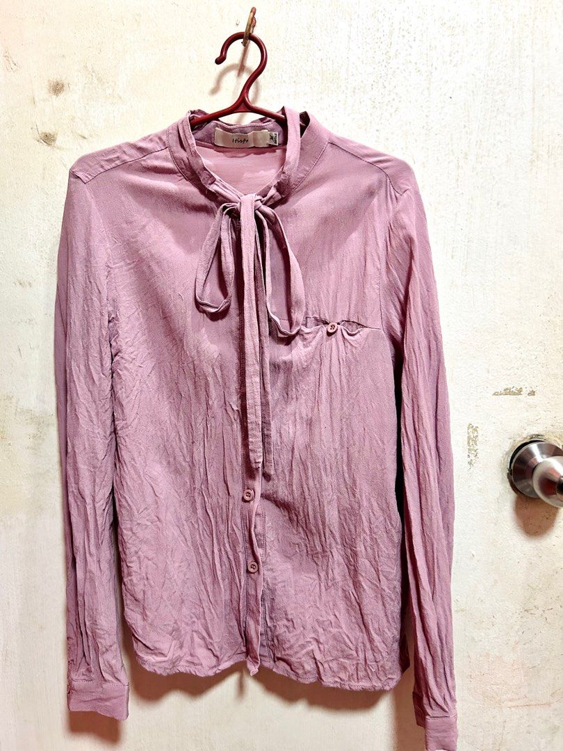 Insieme Dusty Pink Blouse (Category: Blouses) located in Caloocan City. Submitted by decluttervette (Listing ID 1405565850, Image 1). Description: - Dusty pink Insieme blouse - Tie-neck design - Long sleeves - Single chest pocket - Button-down front closure - Fabric with a slight sheen.