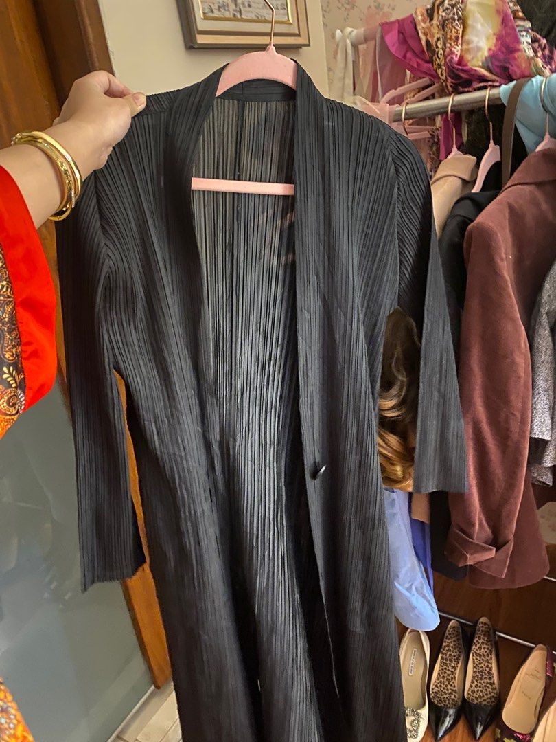 ISSEY MIYAKE Pleated Long Black (Category: Coats, Jackets and Outerwear) located in Quezon City. Submitted by reigniris (Listing ID 1405597884, Image 1). Description: - Black pleated coat - Size S - Single button closure - Long sleeves - 100% polyester - Versatile layering piece.