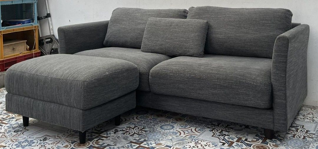 Karimoku 2-Seater Sofa with Ottoman (Category: Sofas) located in Valenzuela. Submitted by princeraya55649 (Listing ID 1405595436, Image 1). Description: - 3 seater sofa with ottoman - Neutral gray fabric - Includes 2 back cushions and 1 lumbar pillow - Ottoman for extra seating/footrest - Modern design with black legs - Karimoku brand.
