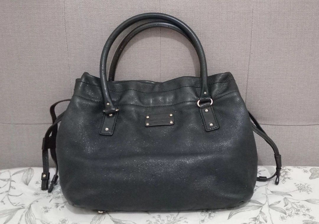 Kate Spade Black Leather Tote Bag (Category: Tote Bags) located in Pasig City. Submitted by chelemmm (Listing ID 1405646191, Image 1). Description: - Kate Spade black leather tote bag - Features double handles - Spacious interior - Classic design - No other includions, got it as a gift from US.